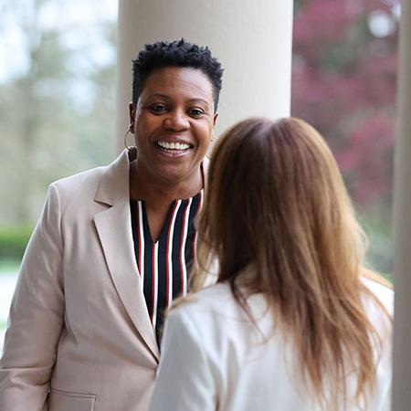 Graduate students at Immaculata University speaking to each other